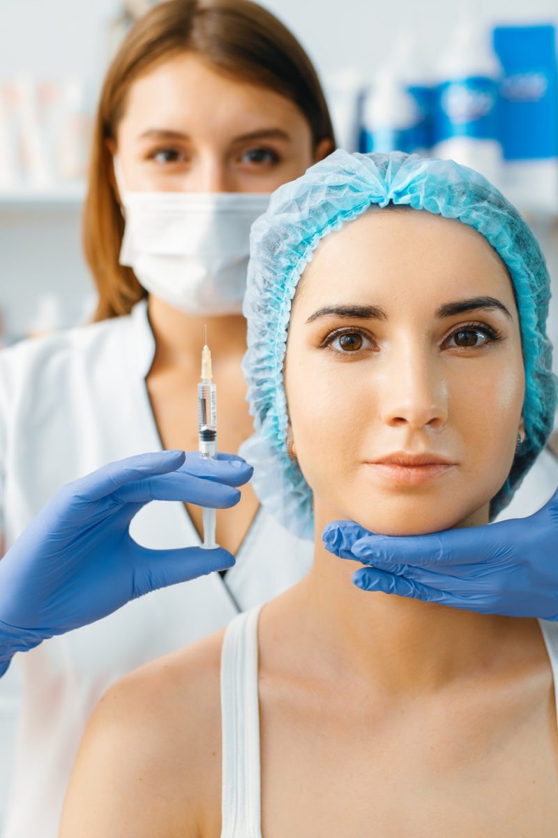 cosmetician-holds-syringe-with-injection-of-botox.jpg